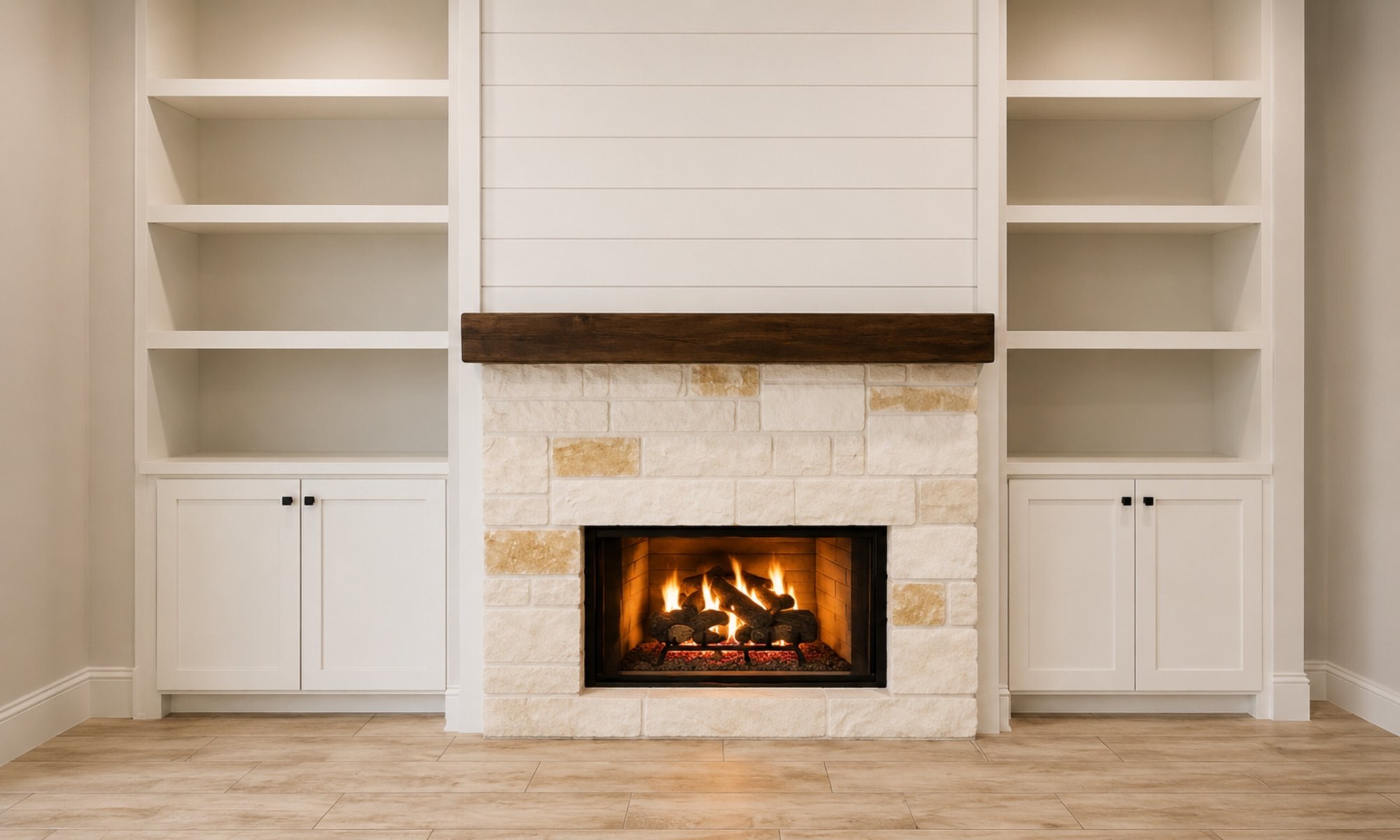 Custom gas fireplace with a natural stone surround, rustic wood mantel, shiplap accent wall, and built-in cabinets.
